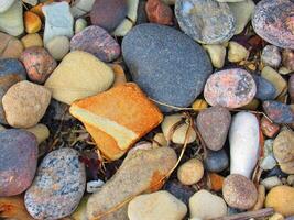 a pile of rocks and stones on the ground photo