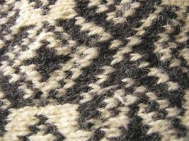 a close up of a knitted sweater with a pattern photo
