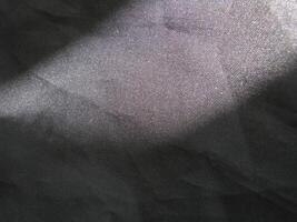 a close up of dark gray fabric photo