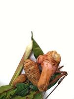 spices consisting of turmeric, galangal, bay leaves, ginger for food seasoning on a white background photo