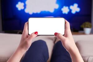 Holding a phone mockup horizontally, showcasing an isolated display for game promotion. Ideal for gaming, technology, and app marketing content photo