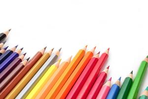 Selective focus, Top view of colored pencils or pastel on white background. Learning, study and presentation concept. photo