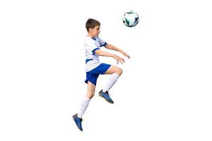Isolated young soccer player leaps into the air, using his head to direct the ball in a dynamic and intense soccer match scene photo