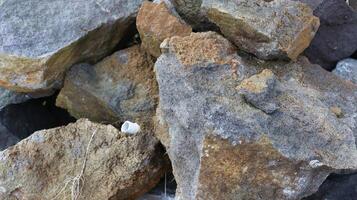 close up texture of rock fragments and soil as background photo
