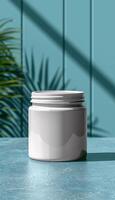 a white cylindrical container with a lid, placed on a textured surface against a blue background, ideal for a branding or product design mockup photo