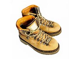Old yellow boots on white background photo