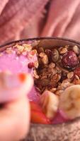 Indulge in a nutritious Smoothie Bowl with a variety of fresh fruits and nuts for a healthful boost video