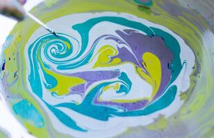 Process of creating painting in ebru technique. photo