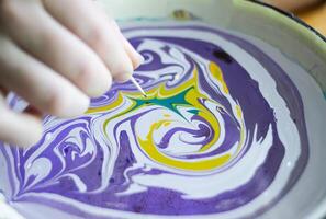 Process of creating painting in ebru technique. photo
