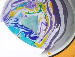 Process of creating painting in ebru technique. photo