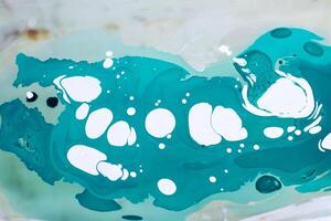 Process of creating painting in ebru technique. photo
