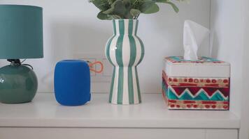 smart speaker and a table lamp on a table video