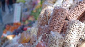 many mixed nuts in a plastic packet on shelf video