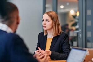 Businesswoman Leading Discussion in Modern Office Setting photo