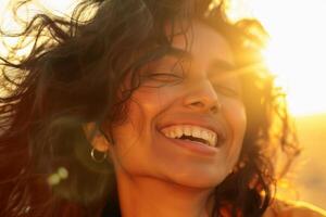 A South Asian woman laughing with her eyes closed, sunlight filtering through her hair and casting a warm glow on her face. AI generate photo