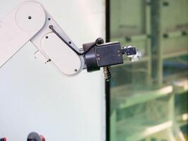 Arm robot hand electricity electronoc technology industry factory automate engineer futurist production ai artificial intelligence cyborg work job occupation business mechenic concept assembly photo