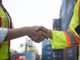 shake hand agreement business cargo logistic factory industry import export transportation teamwork trade warehouse international global container shipping success contract deal freight commerce port photo
