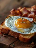 toast with cheese and bacon with a fried egg on top photo