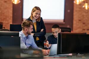 Strategic Business Meeting. Group of Professionals Collaborating in Office Using Computers photo