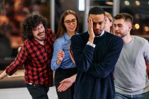 A group of young business people have fun playing interesting games while taking a break from work in a modern office. Selective focus photo