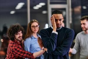 A group of young business people have fun playing interesting games while taking a break from work in a modern office. Selective focus photo