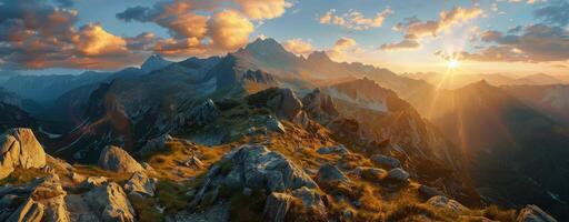 Majestic Mountain Range at Sunset With Golden Clouds photo