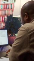 Vertical Professional entrepreneur examining blueprints and using digital tools for office space planning and development. Business owner workspace design for renting, investment strategy. Camera B. video