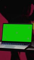 Vertical China army soldier using isolated screen laptop and tablet to identify threats from enemies. Army personnel using software on chroma key devices to relay info to war front lines, camera A video