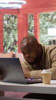 Vertical Entrepreneur sleeping on his home office desk after stressful analysis for the online business he is running. Tired fatigued businessman getting some rest with a nap, burnout. Camera B. video