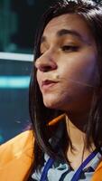 Vertical AI expert showcasing new cutting edge technologies, discussing industry advancements. Extreme close up of woman sharing latest developments in AI and Big Data industries, camera B video