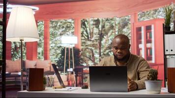 Entrepreneur examining accounting data reports on a software at home, feeling frustrated working on resources allocation with statistics. Adviser failing to achieve strategic objectives. Camera B. video