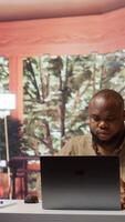 Vertical Entrepreneur examining accounting data reports on a software at home, feeling frustrated working on resources allocation with statistics. Adviser failing to achieve strategic objectives. Camera B. video