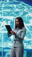 Vertical Developer using tablet to implement artificial intelligence parallel processing, breaking up complex computational tasks enabling AI systems to process more input data faster, camera B video