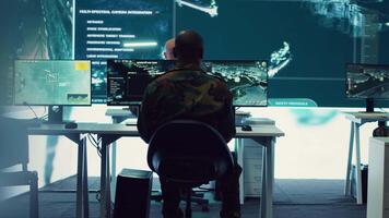 Army officer establishing new operating bases through a world map satellite vision, ensure the connectivity to the power base command center. Commander operates CCTV radar footage. Camera A. video