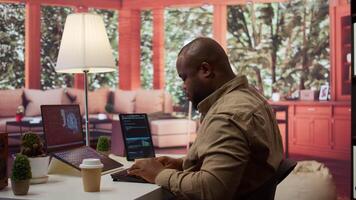 Software engineer coding on a laptop focusing on deep learning, database management and binary code to develop next generation AI solutions and interfaces. Database processing. Camera B. video