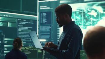 Cyber security team investigates governmental hacking malware attack on internet servers, high tech office. Cybercriminals hack computer systems, threatening account database protection. Camera A. video