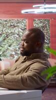 Vertical Businessman conducting a videocall meeting online with shareholders, reviewing data analytics and statistics to obtain funds for investment and development strategy. Startup growth. Camera B. video