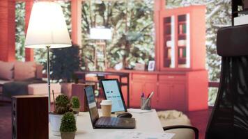 Empty modern home workstation of an entrepreneur with laptop and tablet, financial analytics data studied for startup investment and development. Remote job in business industry. video