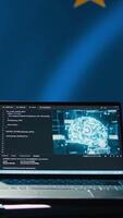 Vertical AI software on laptop used by European Union member states security services to prevent terrorism. Artificial intelligence tech used by Europe countries to defend, isolated over EU flag, camera B video