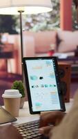 Vertical Professional software developer at desk working on AI coding and machine learning projects, showcasing innovation in software development and digital business. Internet of things. Camera B. video