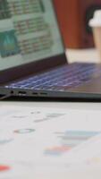 Vertical Empty modern office of a business entrepreneur with laptop running financial analysis plans for startup investment and expansion. Remote work on infographics and bank account analytics. video