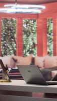 Vertical Home based entrepreneur using laptop for online trading and project management, ensuring successful remote work environment. Focusing on financial analysis in telecommuting setup. Camera B. video