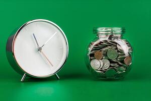 Saving coins in a glass jar creates a good financial and investment asset. Financial growth and investment returns photo