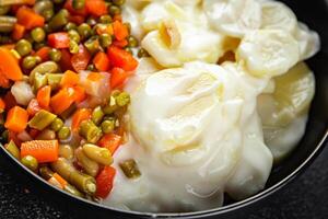potatoes with vegetables second course natural fresh appetizer meal food snack on the table copy space food background rustic top view keto or paleo diet photo
