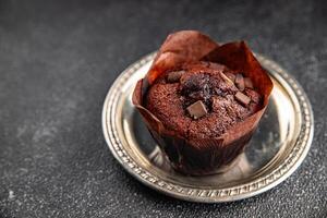 muffin chocolate cupcake sweet dessert cake appetizer meal food snack on the table copy space food background rustic top view photo