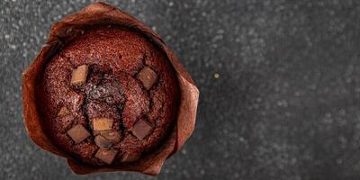 muffin chocolate cupcake sweet dessert cake appetizer meal food snack on the table copy space food background rustic top view photo