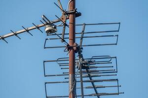rusted roof antenna for television and radio photo