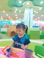 Positive activities for children playing in an indoor area filled with toy facilities and a place where they can find unlimited creativity photo