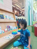 Positive activities for children playing in an indoor area filled with toy facilities and a place where they can find unlimited creativity photo