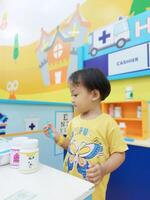 Positive activities for children playing in an indoor area filled with toy facilities and a place where they can find unlimited creativity photo